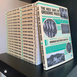 The Holy Days of Gregorio Pasos a novel by Rodrigo Restrepo Montoya, stack of books