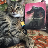 Not Dark Yet book with cat